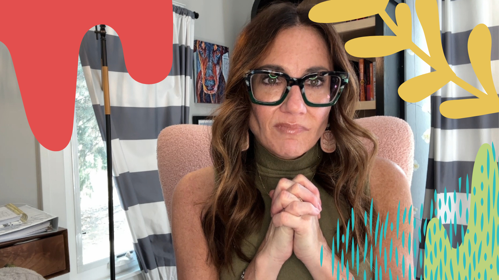 A woman records a video of herself in her home.