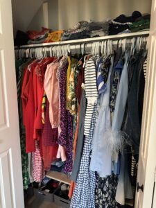 A color coded closet in a home.