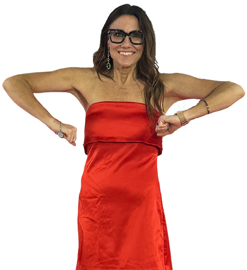 Kim Bode awkwardly standing with her arms out.