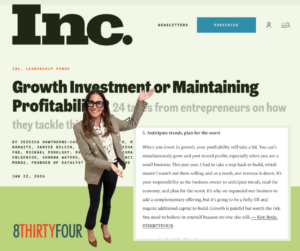Kim poses next to her excerpt in the Inc. Magazine article, Growth Investment or Maintaining Profitability?