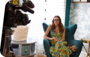 Kim Bode gives an interview in front of a camera at the 8THIRTYFOUR office.