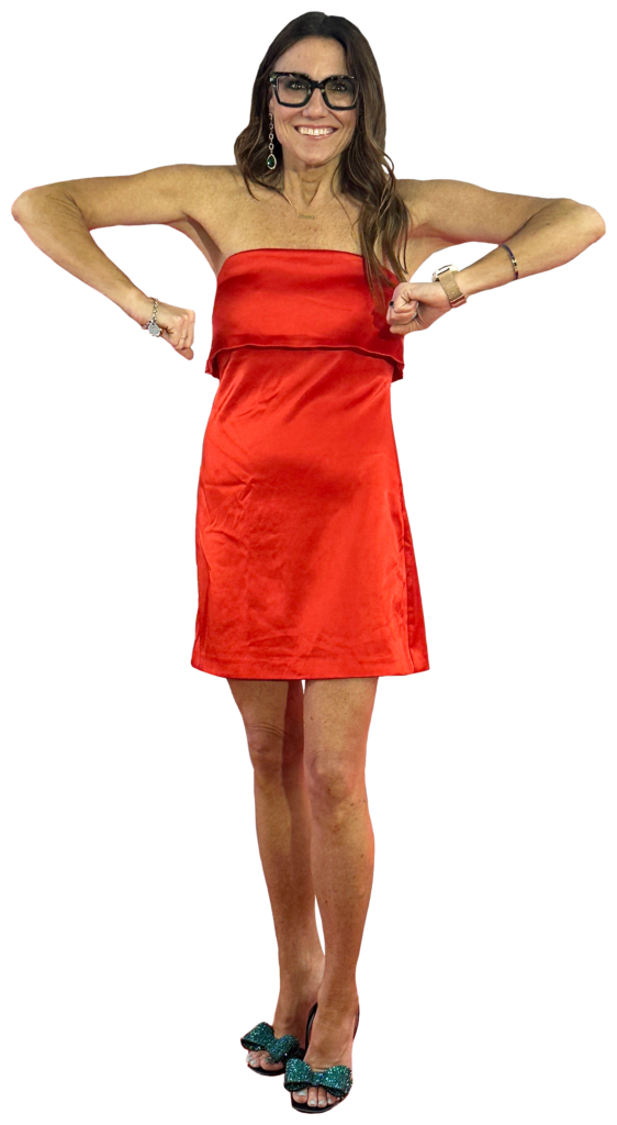 Kim Bode stands with her hands at an awkward angle.