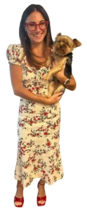 Kim Bode smiles while holding her dog, River.