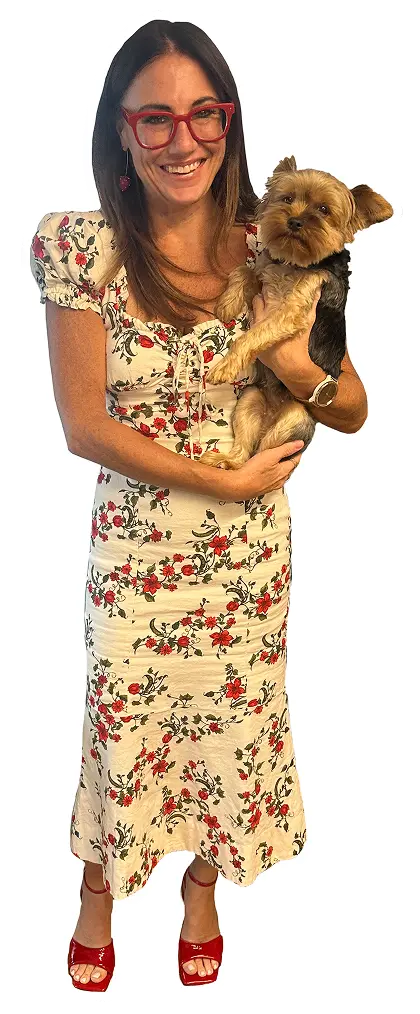 Kim Bode smiles while holding her dog, River.