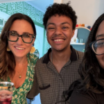Kim Bode with a young man and woman smiling for a selfie.