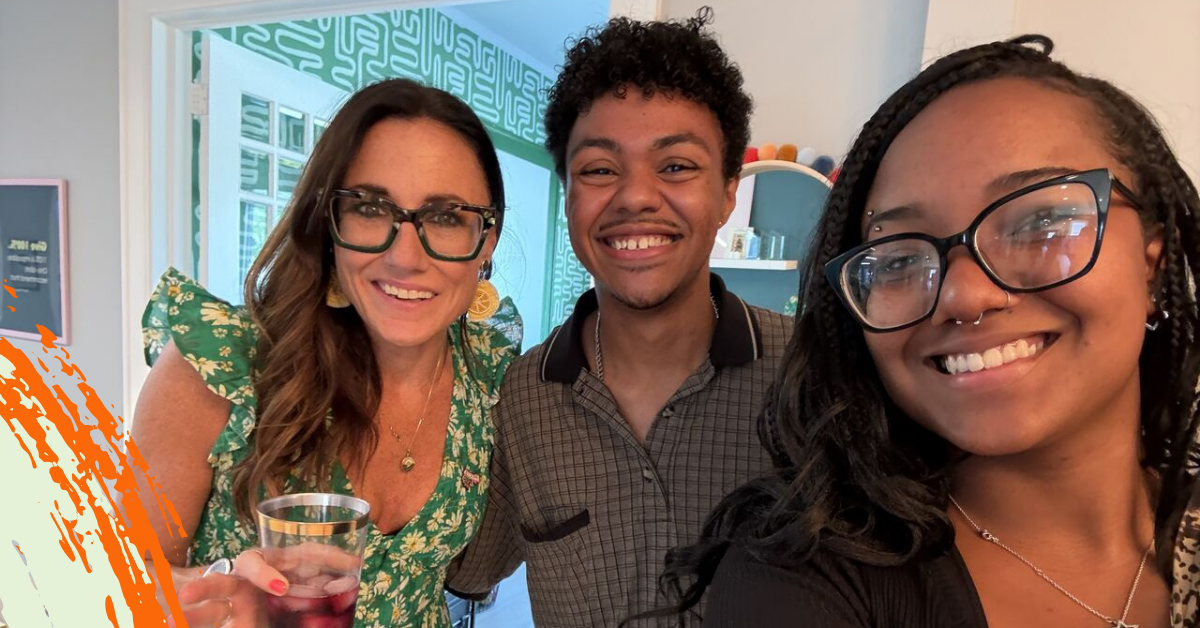 Kim Bode with a young man and woman smiling for a selfie.